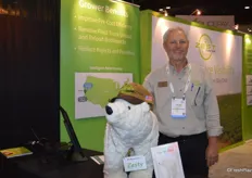 Kevin Payne with Zest Labs proudly takes a picture with Zesty, the company mascot.